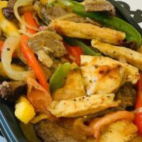 Fajitas · French Fries  Sauteed Steak and Chicken with Green and Red Peppers, Onions and Mushroon