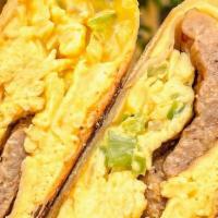 Breakfast Wrap · Scrambled eggs, yellow american cheese, onions, peppers and your choice of meat