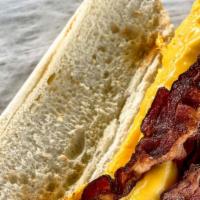 Bacon, Eggs, And Cheese Sub · Scrambled eggs, bacon and yellow american cheese served on a hoagie roll