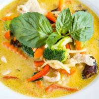 Green Curry Chicken · Chicken simmered with green curry coconut milk, kaffir, bamboo shoots, peppers, peas and bas...