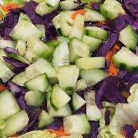 Green Salad · Fresh mixed lettuce, tomatoes, carrot, red cabbage, cucumbers, and your choice of sauce.