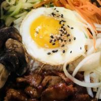Spicy Pork Bibimbap · Spicy. Spicy pork rice bowl mixed with vegetables with fried egg.