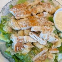 Grilled Chicken Caesar Salad · Mixed greens, tossed with classic Caesar dressing and Parmesan cheese. Topped with a grilled...