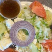 Greek Salad · Mixed greens, tomatoes, cucumbers, pepperoncinis, olives and feta cheese.