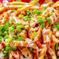 Loaded Vegan Buffalo Chick'N-On-Fries · Pile high crispy French fries topped with pieces of juicy vegan chick'n tossed in Buffalo sa...