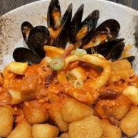 Pescado A Lo Macho · Lightly fried corvina, shrimp, calamari and mussels in an a lo macho sauce.