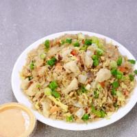 Chicken Fried Rice · Chicken, egg, onions, peas, and green onion.