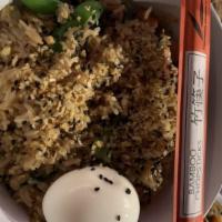 Spam  Fried Rice · crispy spam, barrel-aged teriyaki sauce, baby corn, English peas, 1-hour egg, pea tendrils.