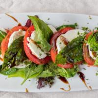 Insalata Caprese · Slices of tomatoes, fresh mozzarella, topped with fresh basil, olive oil and a touch of bals...