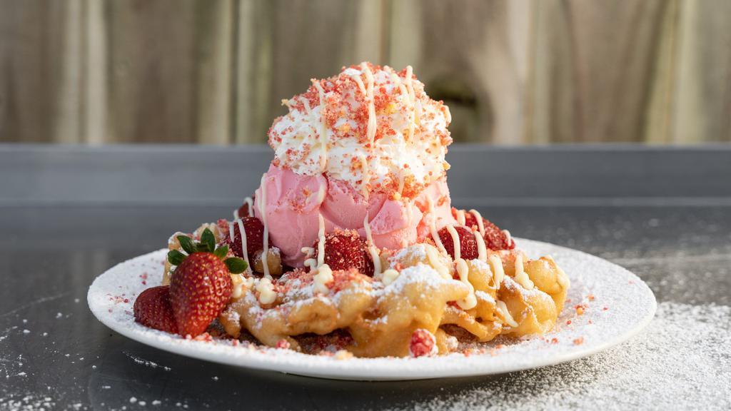 Strawberry Shortcake Funnel Cake · Served with sliced strawberries, strawberry ice cream, whipped cream, shortcake crumbs, pudding drizzle.