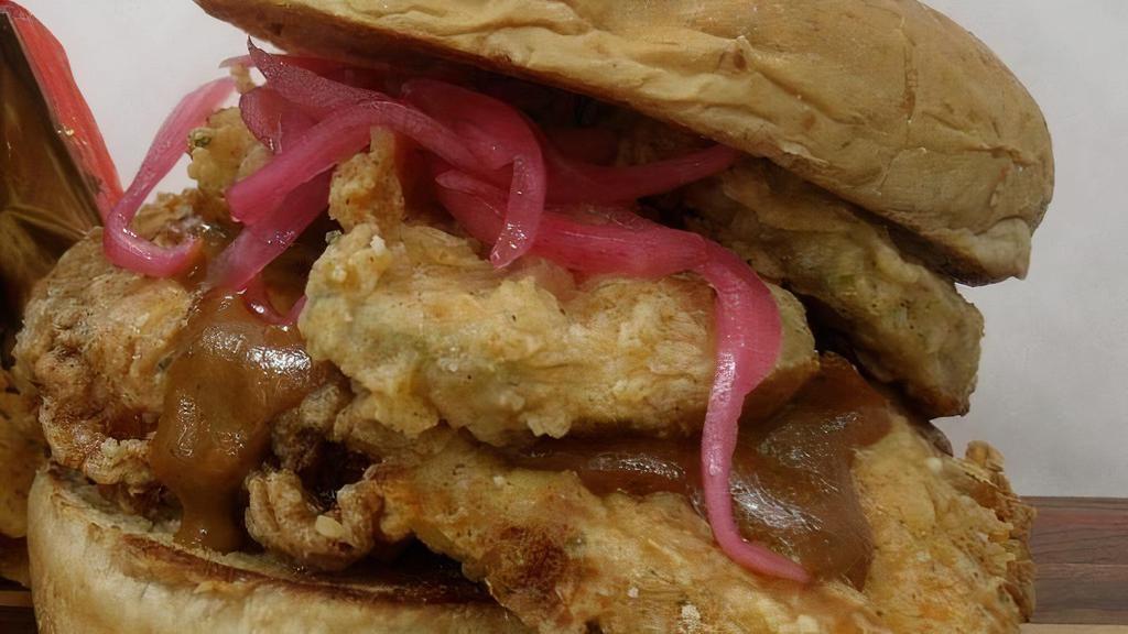 Georgia Gold · Fried chicken breast, GA gold sauce, fried pickles, pickled red onions.