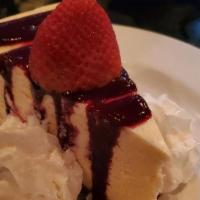 101 New York Style Cheesecake · raspberry coulis