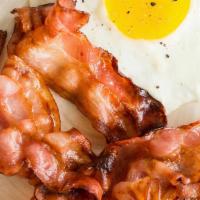 Eggs With Bacon · Two eggs are served with choice of fries, grits, oatmeal, or sliced tomato, and choice of ba...