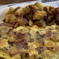 Cheese Omelette With One Meat · Omelette is made with three farm fresh eggs. Served with choice of one fries, grits oatmeal,...