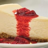 New York-Style Cheesecake Slice · A rich and creamy New York-style cheesecake baked inside a honey-graham crust. Try with swee...