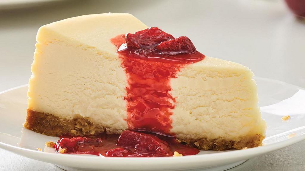 New York-Style Cheesecake Slice · A rich and creamy New York-style cheesecake baked inside a honey-graham crust. Try with sweet strawberries in strawberry sauce, or with blueberry toppings for an additional charge.