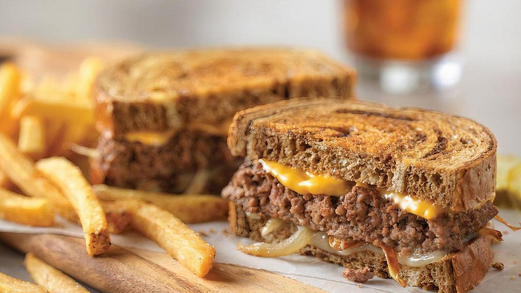 Patty Melt* · Sautéed onions, American and Swiss cheeses on grilled marbled rye bread.