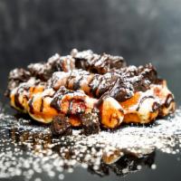 Nutella Fudge Brownie · Toasted Belgian waffle with Nutella, fudge brownie bites, chocolate chips, chocolate sauce a...