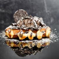 .O..M..G.. · Toasted Belgian waffle with Oreo icing, Oreo pieces, chocolate sauce and powdered sugar.