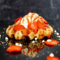 Strawberry Cheesecake · Toasted Belgian waffle with cream cheese icing, fresh strawberries, strawberry jam, graham c...