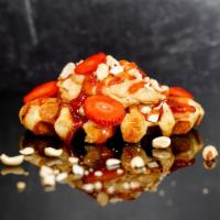 Pb N' J · Toasted Belgian waffle with peanut butter icing, strawberry jam, fresh strawberries and toas...