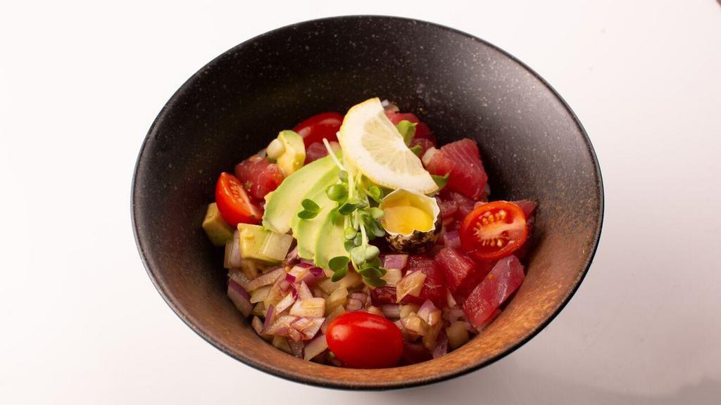 Tuna Poke Bowl · Tuna cubes, cucumber, tomato, onion, scallion, avocado and quail egg with yuzu sauce. Served with house salad.