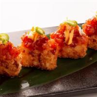 Spicy Tuna Crispy Rice · Spicy tuna tartare on lightly fried crispy sushi rice with sliced jalapeño.