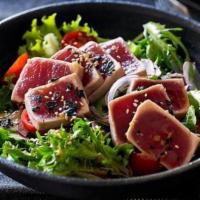 Tuna Tataki Salad · Lightly seared tuna with cucumber and spring mix with tataki sauce.