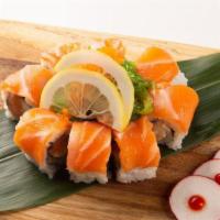 Orange Blossom Roll · Spicy salmon and cucumber topped with salmon, seaweed salad and masago.