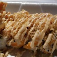 Rock & Roll · Shrimp tempura, imitation crab, avocado, asparagus, masago topped with tempura flake, spicy ...