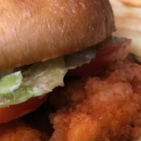 Buffalo Chicken Sandwich · Fried or Grilled tossed in buffalo sauce, served on toasted bun  with lettuce , tomato and r...