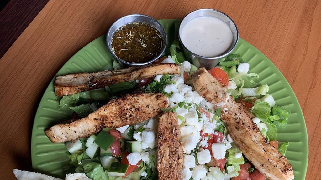 Side Greek Salad · Side greek includes mixed greens, tomatoes, cucumbers, green peepers, red onion, Kalamatta olives, feta . 1 portion of greek dressing. You may order extra dressing at .075 each .