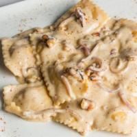 Ravioli E Pera In Salsa Di Noci · Ricotta cheese & pear ravioli in a creamy walnut sauce.