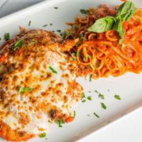 Chicken Parmigiana · Breaded chicken breast, tomato sauce, mozzarella. Served with pasta of the day.