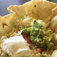 Taco Salad · Three crispy tortilla shells stuffed with beef or chicken beans, lettuce, sour cream, and ch...