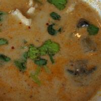 Tom Kha 
 · Clear broth with coconut milk, galanga, lemongrass, mushrooms, red onions, tomatoes, and pro...