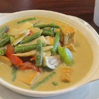 Green Curry   · Spicy. Green curry paste, Thai eggplant, basil, peas & green beans