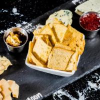 Artisanal Cheese Plate · Farmstead Cheeses and Seasonal Accompaniments.