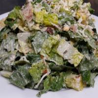 Yeyo Salad · Romaine lettuce tossed with grilled chicken, shucked corn, jack cheese, croutons and smoked ...