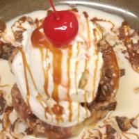 Baby'S Guava Bread Pudding · House made guava bread pudding served with vanilla ice cream. Topped with roasted pecans, to...