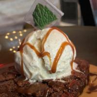 Kush Brownie Sundae · House made Kush Brownie with Pecans, topped with Caramel, Ice Cream, Chopped Candied Bacon a...