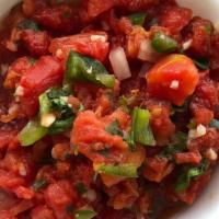 Chunky Red Salsa  · Tomatoes, yellow onions, cilantro. jalapeños, spices and lime juice.