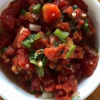 Chunky Red Salsa ( Large)  · Tomatoes, yellow onions, cilantro. jalapeños, spices and lime juice.