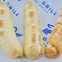 Cheese Tequeños · Fried puff pastry dough stick stuffed with white cheese