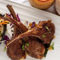 Geah Yang / Lamb Chops · Thai-style BBQ lamb chops with jicama pea nut slaw and sticky rice.