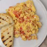 Pericos · Two scrambled eggs with onions and tomatoes. your choice of toast or arepa.