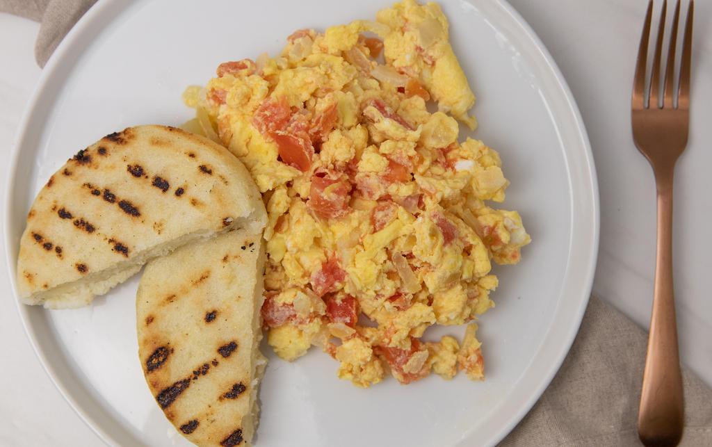 Pericos · Two scrambled eggs with onions and tomatoes. your choice of toast or arepa.