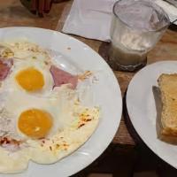 Fried Eggs · Two eggs cooked to perfection and your choice of arepa or toast .