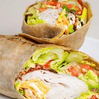 Miracle Avacado Wrap · Oven gold roasted turkey, avocado, bacon, American cheese, lettuce tomato and mayo. Served w...