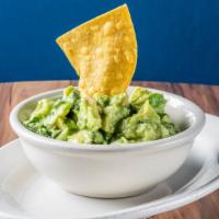 Chunky Mexican Guacamole · Made fresh with sliced avocados, onions, cilantro, tomato, jalapenos, salt, and a hint of li...